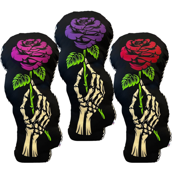goth print pillows. skeleton hand holding a single rose. comes in 3 colors. red rose, magenta rose. deep purple rose. mixed prints, skeleton hand pillows have side stripe print and a polkadot back print. truly unique goth home decor