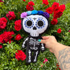 12 inch tall day of the dead skeleton plush with custom face printing satin lace flower halo and in  black minky white embroidery beautiful embroidery high quality plush halloween skeleton bat plushie halloween goth home decor childrens halloween dia de lost muertos skeleton plush day of the dead plush skeleton plush toy