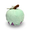 Plush toy resembling a green apple with a small bird on top against a white background