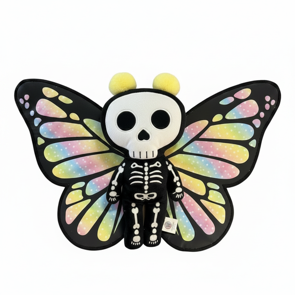 Butterfly-shaped plush toy with a skeleton design on a white background