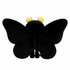Black butterfly-shaped object with yellow accents on a white background