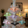 Decorative Christmas tree with colorful bat-shaped ornaments in a home setting.