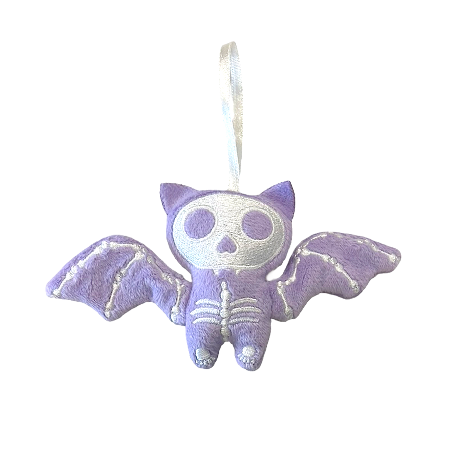 Purple bat-shaped plush toy with a skeleton design on a white background