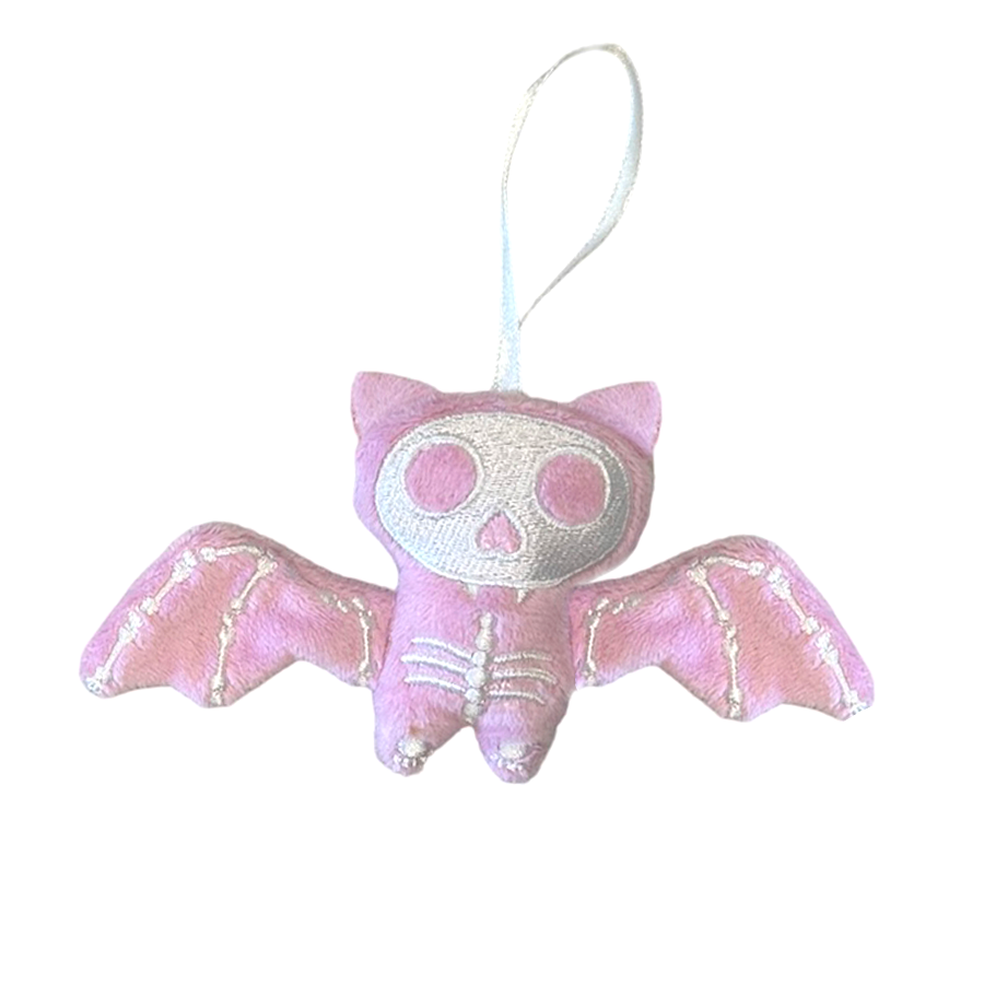Pink bat-shaped plush toy with skeleton face on a white background