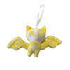 Yellow bat-shaped ornament with skeleton design on a white background