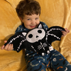 cute toddler holding a plush skeleton bat so cute. halloween kids gift