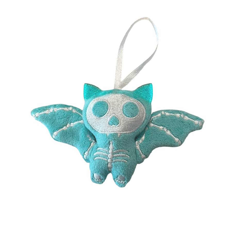 Teal bat-shaped plush toy with a skull face on a white background