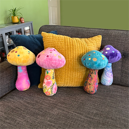 turquoise mushroom with yellow multi colored flower fabric print dopamine decore weirdcore plush glitter colorful mushroom plushies soft minky top fun colorful print stuffed stems with fun glitter dot patterns on caps unique gift dorm decor dopamine home decor happy hippy gifts